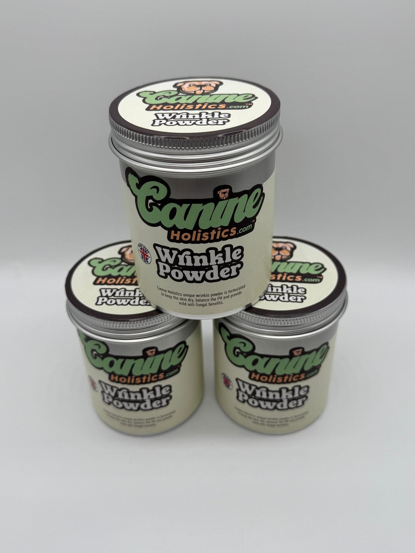 Image containing stack of 3 x Canine Holistics™ Wrinkle Powder 250g. Top front view of branded products in aluminium packaging tins stacked on top of each other.