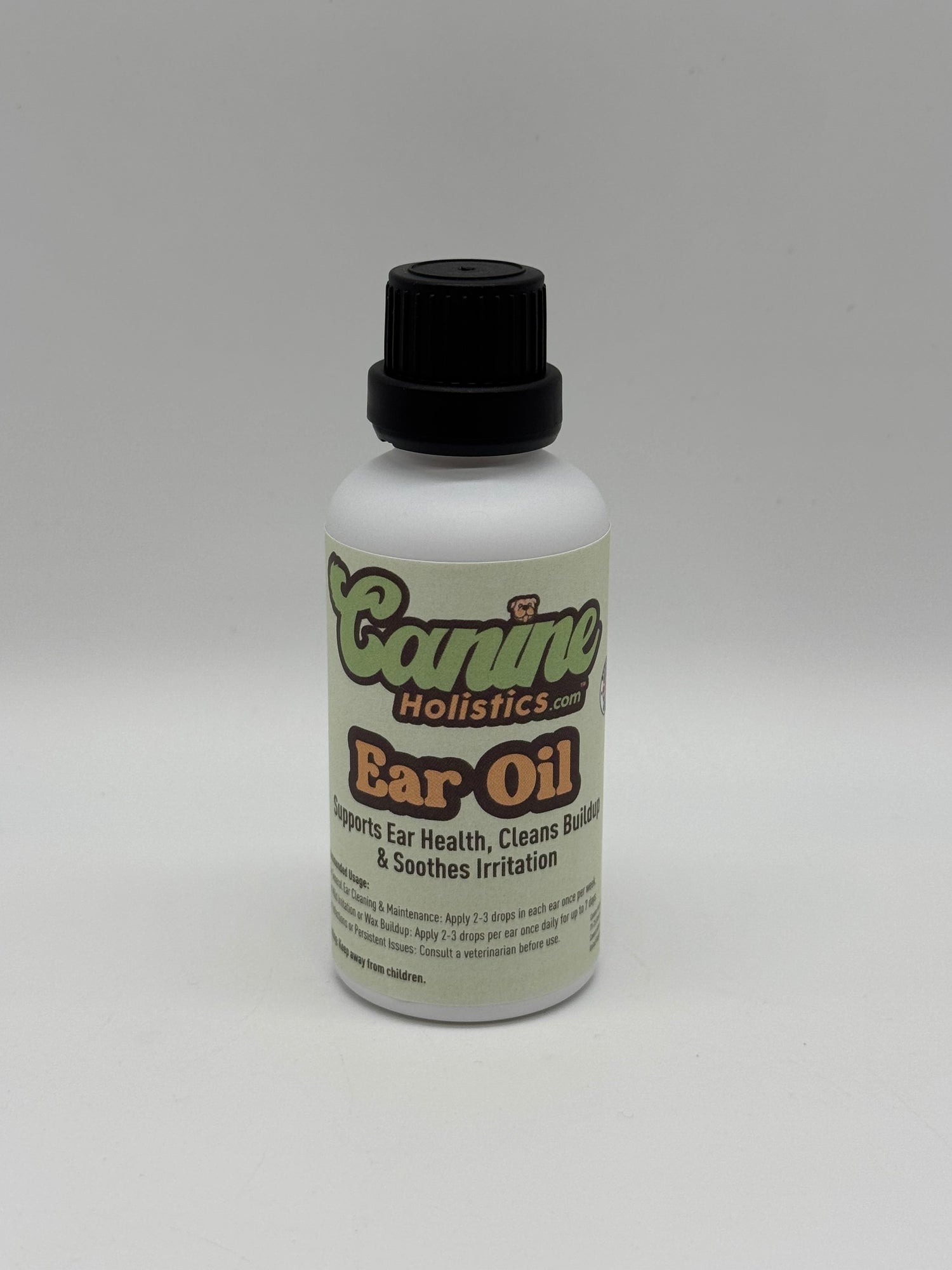 Image of Canine Holistics™ natural ear oil for dogs in a white glass bottle with dripper nozzle and a black lid. Front view of branded product. 
