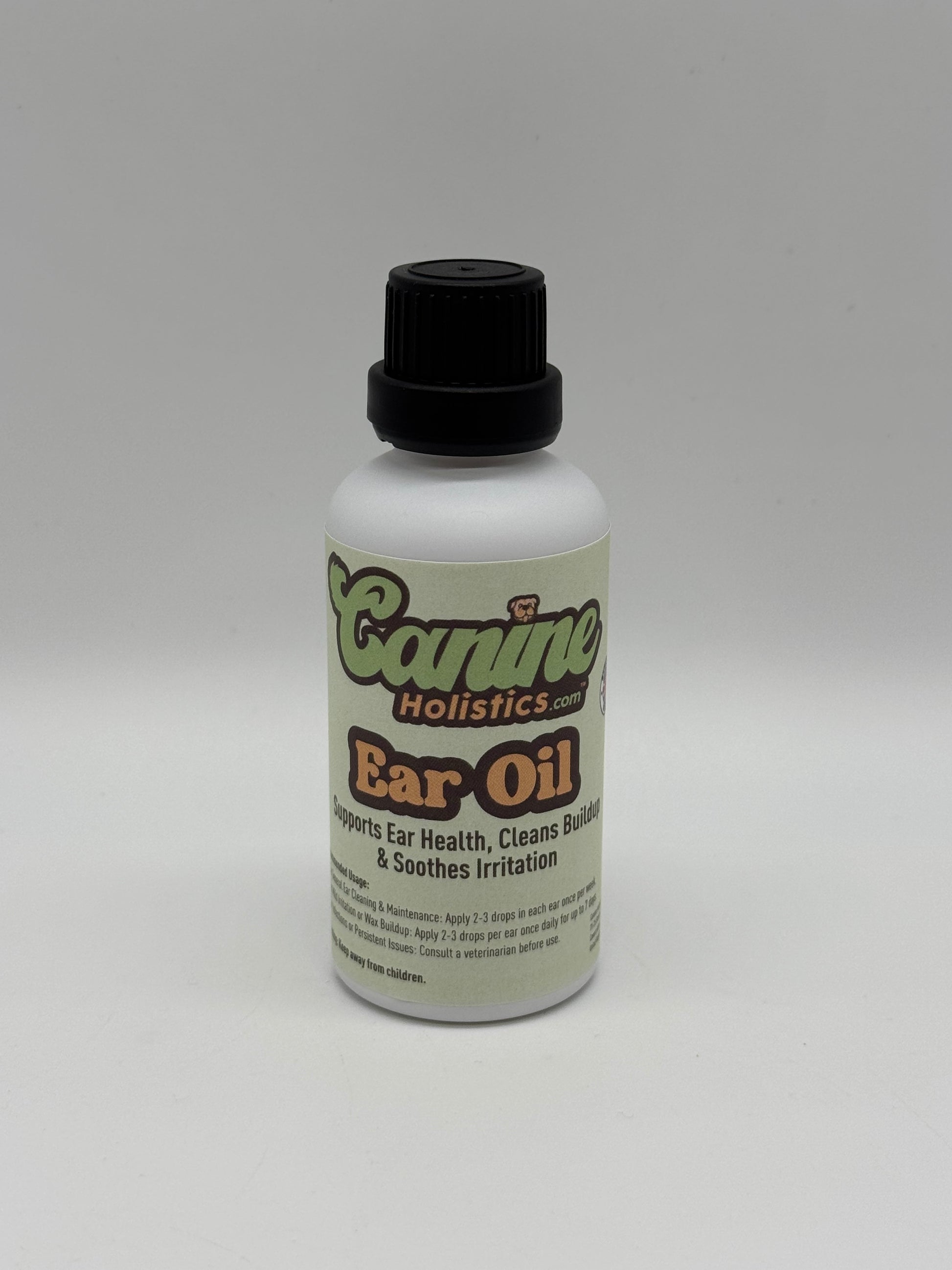 Image of Canine Holistics™ natural ear oil for dogs in a white glass bottle with dripper nozzle and a black lid. Front view of branded product. 