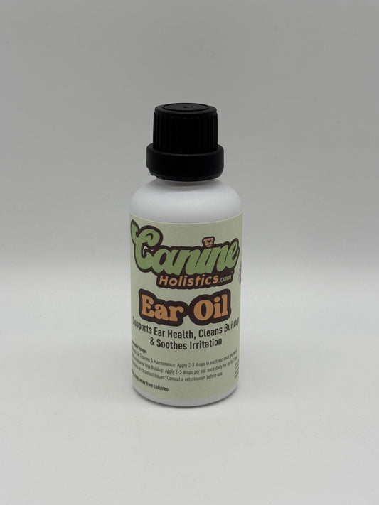 Image of Canine Holistics™ natural ear oil for dogs in a white glass bottle with dripper nozzle and a black lid. Front view of branded product. 