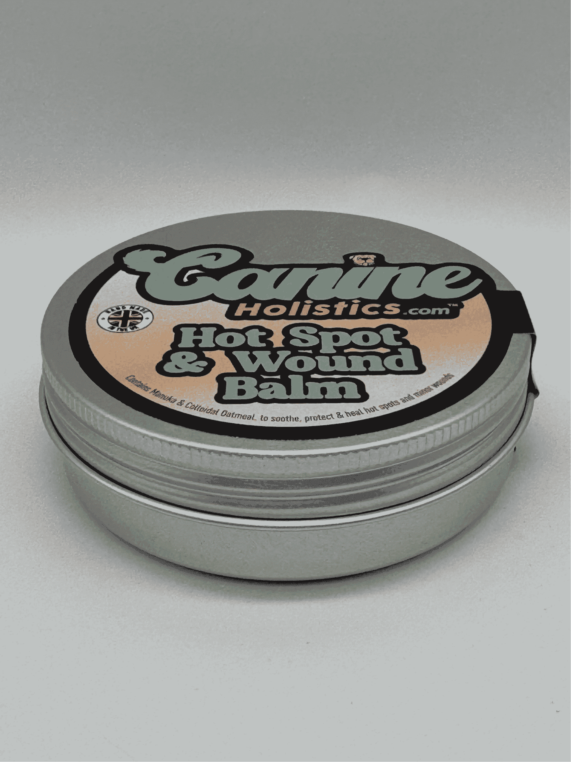 Image of Canine Holistics™ Hot Spot and Wound Balm 100ml tin. Top front view of branded packaging. 