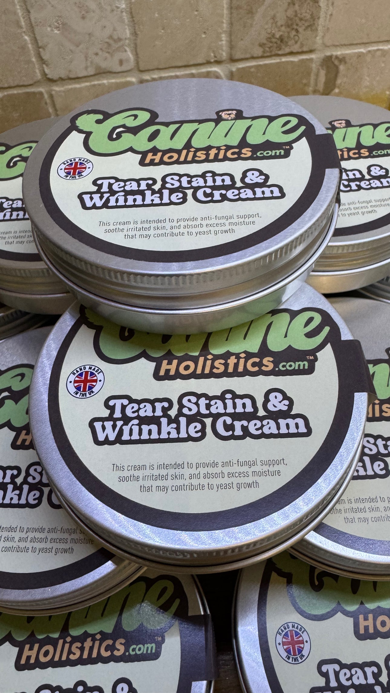 Canine Holistics™ Tear Stain & Wrinkle Cream for Dogs – 100ml eco friendly aluminium tin, top view stack of multiple tins. 