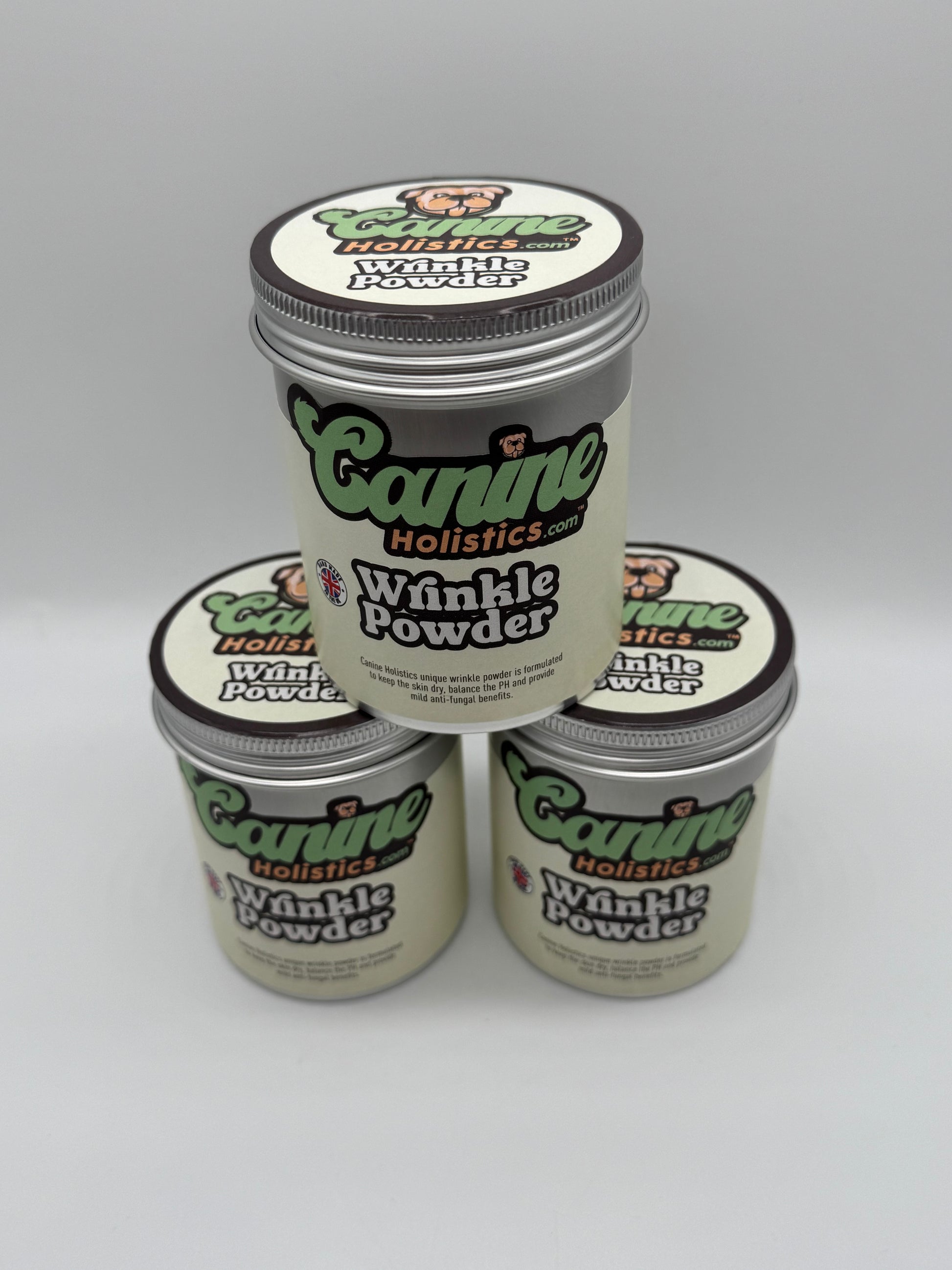 Image containing stack of 3 x Canine Holistics™ Wrinkle Powder 250g. Top front view of branded products in aluminium packaging tins stacked on top of each other. 